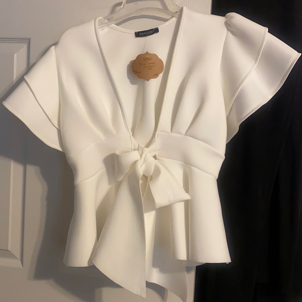 Ruffled sleeve tie front top